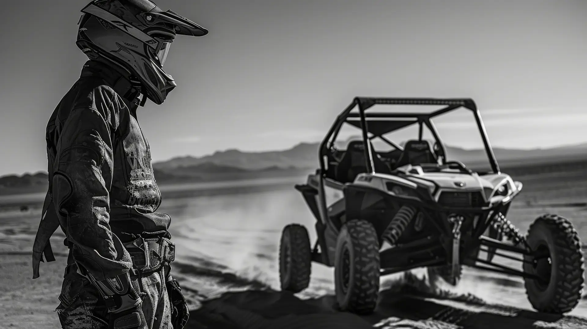 Rider in protective gear standing next to a dune buggy in Hurghada desert safari
